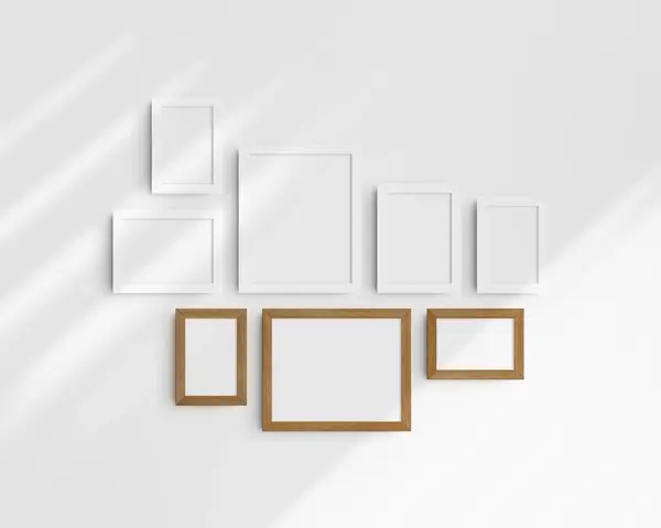 Gallery wall mockup set, 8 white and cherry wood frames. Modern, minimalist frame mockup. Five vertical frames, and three horizontal frames, 4x6 (2:3), 6x4 (3:2), 5x7 (5:7), 7x5 (7:5), 8x10 (4:5), 10x8 (5:4) inches, on a white wall with shadows.