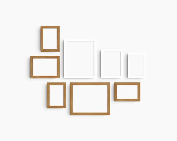 画廊壁面造型套件 8个白色和樱桃木框架 简约的框架模型 白墙上的5个垂直框架和3个水平框架 4X6 6X4 5X7 7X5 8X10 10X8 免版税图库照片