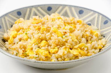 Homemade fried rice mixed with green onion and eggs