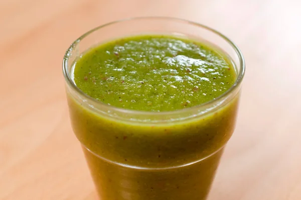 Green smoothie made with green leafy vegetables and fruits