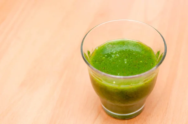 Green smoothie made with green leafy vegetables and fruits