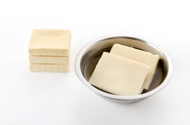 Soak Koya tofu(Freeze Dried Tofu) in water clipart