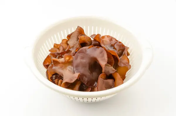 Stock image Jew's ear mushroom in a white plastic colander on white background