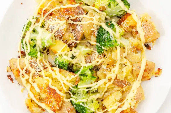 stock image Baked potatoes and broccoli with mayonnaise dressing