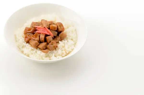 stock image A bowl of white rice topped with braised tuna on isolated white background