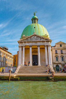 Venice, Italy  September 27, 2019 Panoramic view over busy Grand Canal with many boats, near beautiful Basilica di Santa Maria della Salute and the historical center clipart