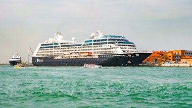 Venice, Italy  September 27, 2019 Panoramic view over busy Grand Canal with many boats, near beautiful Basilica di Santa Maria della Salute and the historical center clipart