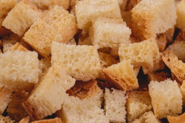 Croutons. Roasted white bread. Close-up of delicious croutons. Macro shot of croutons.