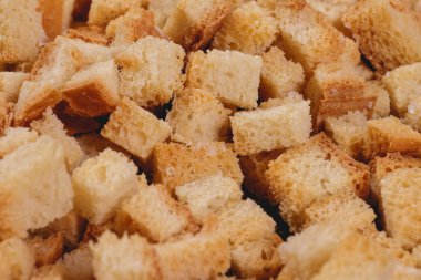 Croutons. Roasted white bread. Close-up of delicious croutons. Macro shot of croutons.