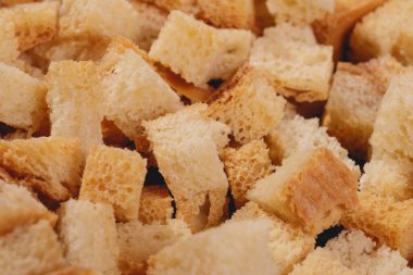 Croutons. Roasted white bread. Close-up of delicious croutons. Macro shot of croutons.