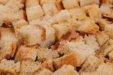Croutons. Roasted white bread. Close-up of delicious croutons. Macro shot of croutons.