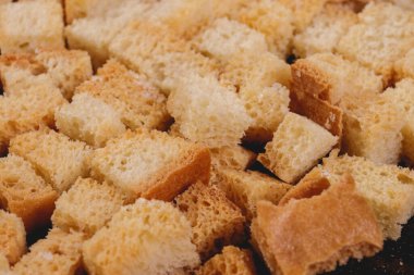 Croutons. Roasted white bread. Close-up of delicious croutons. Macro shot of croutons.