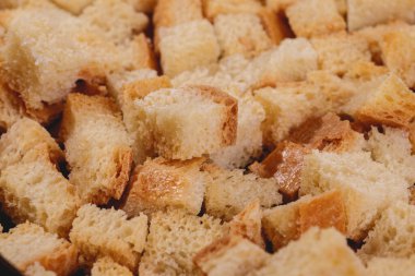 Croutons. Roasted white bread. Close-up of delicious croutons. Macro shot of croutons.