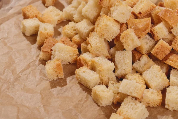 Pieces Roasted White Bread Parchment Paper Close Delicious Croutons — Φωτογραφία Αρχείου