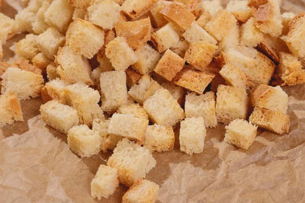Pieces Roasted White Bread Parchment Paper Close Delicious Croutons — Fotografia de Stock