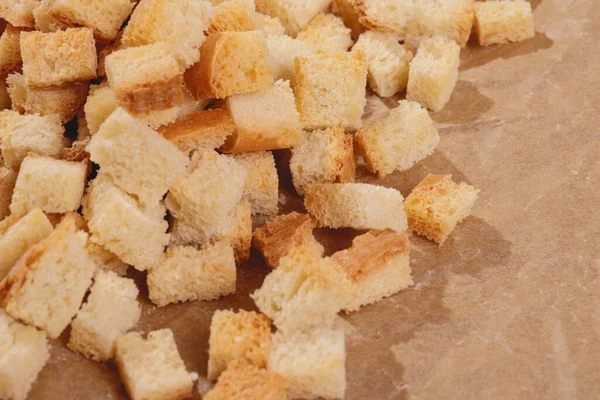 Pieces Roasted White Bread Parchment Paper Close Delicious Croutons — Fotografia de Stock