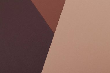 Kahverenginin farklı tonlarından oluşan bir kağıdın çok renkli arkaplanı. Geometrik arkaplan.