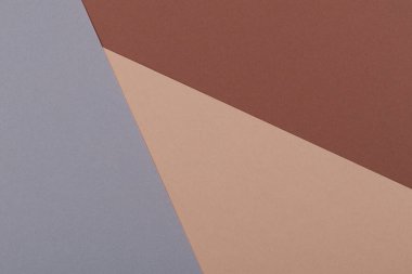 Kahverengi ve grinin farklı tonlarından oluşan bir kağıdın çok renkli arkaplanı. Geometrik arkaplan.