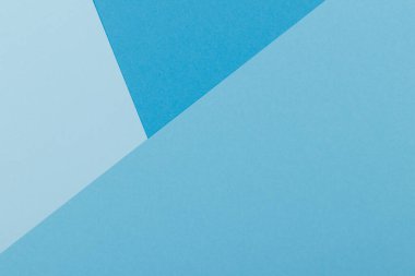 Mavinin farklı tonlarından oluşan bir kağıdın çok renkli arkaplanı. Geometrik arkaplan.