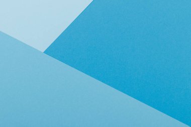 Mavinin farklı tonlarından oluşan bir kağıdın çok renkli arkaplanı. Geometrik arkaplan.