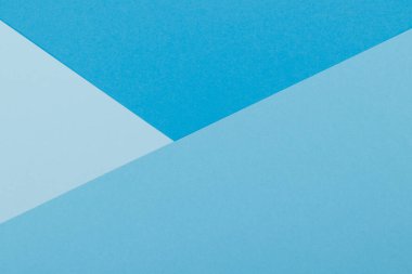 Mavinin farklı tonlarından oluşan bir kağıdın çok renkli arkaplanı. Geometrik arkaplan.