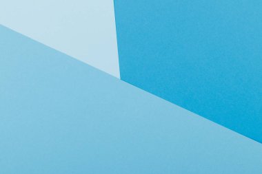 Mavinin farklı tonlarından oluşan bir kağıdın çok renkli arkaplanı. Geometrik arkaplan.