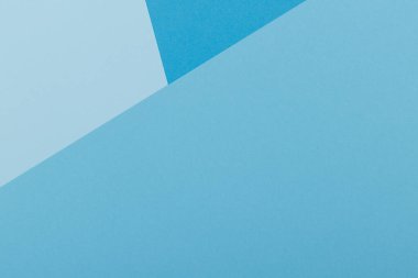 Mavinin farklı tonlarından oluşan bir kağıdın çok renkli arkaplanı. Geometrik arkaplan.