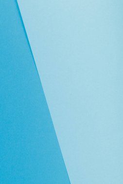 Mavinin farklı tonlarından oluşan bir kağıdın çok renkli arkaplanı. Geometrik arkaplan.