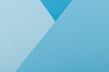 Mavinin farklı tonlarından oluşan bir kağıdın çok renkli arkaplanı. Geometrik arkaplan.