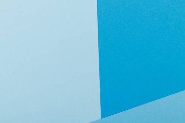 Mavinin farklı tonlarından oluşan bir kağıdın çok renkli arkaplanı. Geometrik arkaplan.