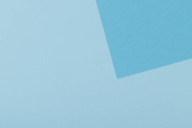 Mavinin farklı tonlarından oluşan bir kağıdın çok renkli arkaplanı. Geometrik arkaplan.