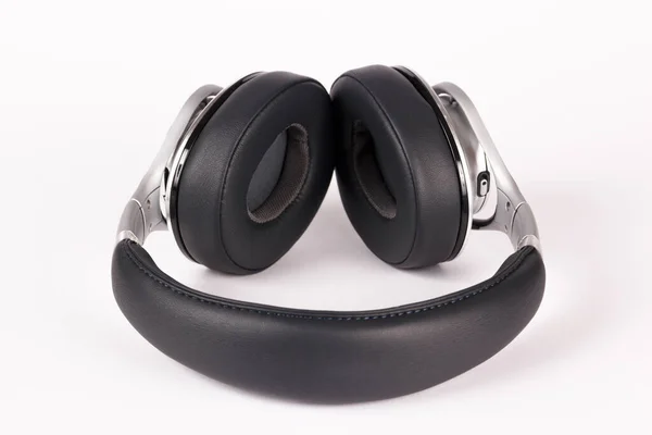 Fekete Ezüst Fejhallgató Feküdt Könnyű Háttér — Stock Fotó