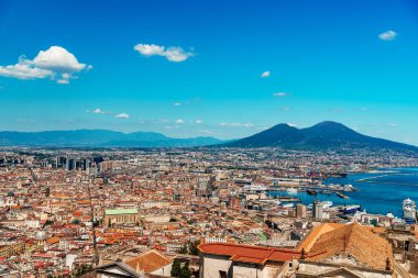 Old city of Naples and volcano Vesuvius. clipart