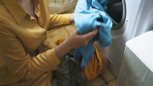 Woman Loading Clothes Washing Machine — Stock Video