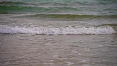 Tropic sea waves on the beach.