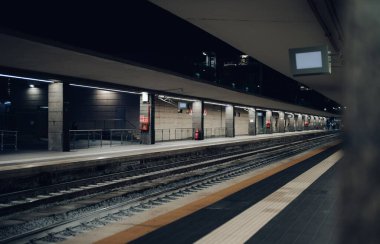 Perspective view of railroad station at evening.