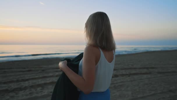 Woman Throws Blanket Herself Sunset Sea — Stockvideo