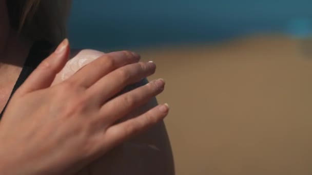 Woman Applying Sunblock Cream Her Shoulder — Stock Video