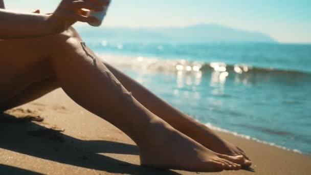 Woman Applying Sunblock Cream Her Legs Sea — Stock Video