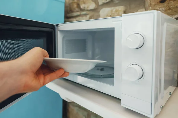 Man Putting Plate Food Heat Microwave — Stock Photo, Image