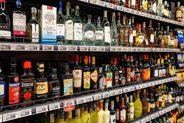 Italy, Naples - 22.10.2022: Shelves with strong alcohol in the store.
