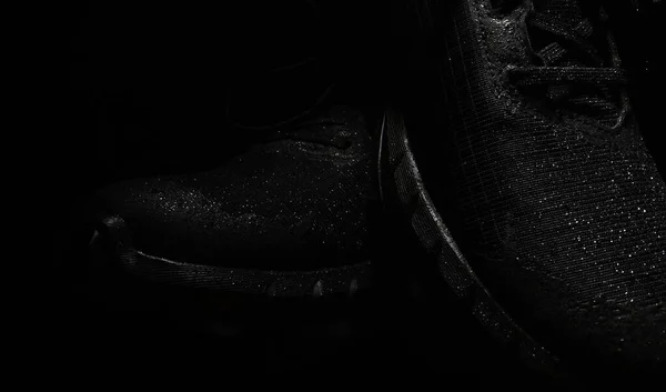 Waterproof black running shoes. Suitable for shoe advertising.