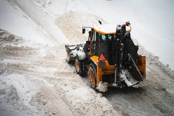 Tractor Shoveling Snow Street Stock Photo
