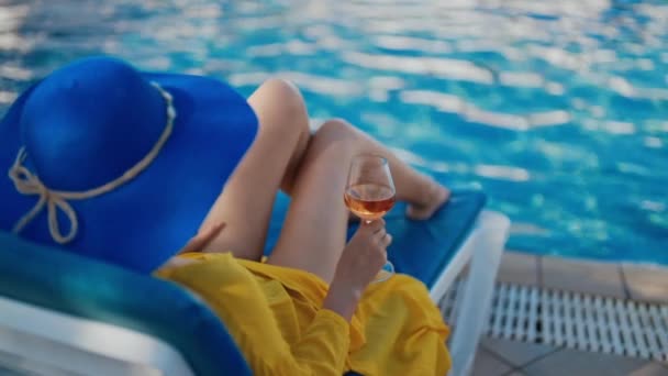 Woman Blue Hat Relaxing Pool Video Clip
