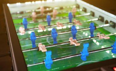 Table football game with white and blue players.