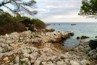 Popular hiking trail in the south of France on Cap d'Antibes. clipart