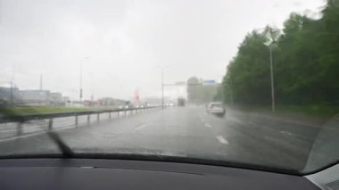 Driving car in bad weather conditions. Heavy rain.