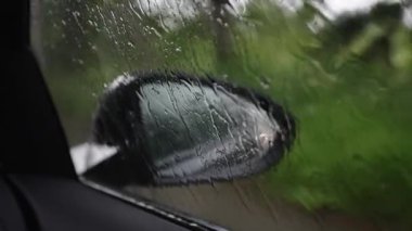 Driving car in bad weather conditions. Heavy rain.