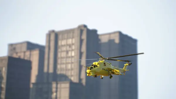 Yellow helicopter during a rescue operation in the city. 3d render.