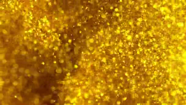 輝く黄金の粒子の超スローモーション 焦点の浅い深さ 高速フィルムカメラで撮影しました — ストック動画